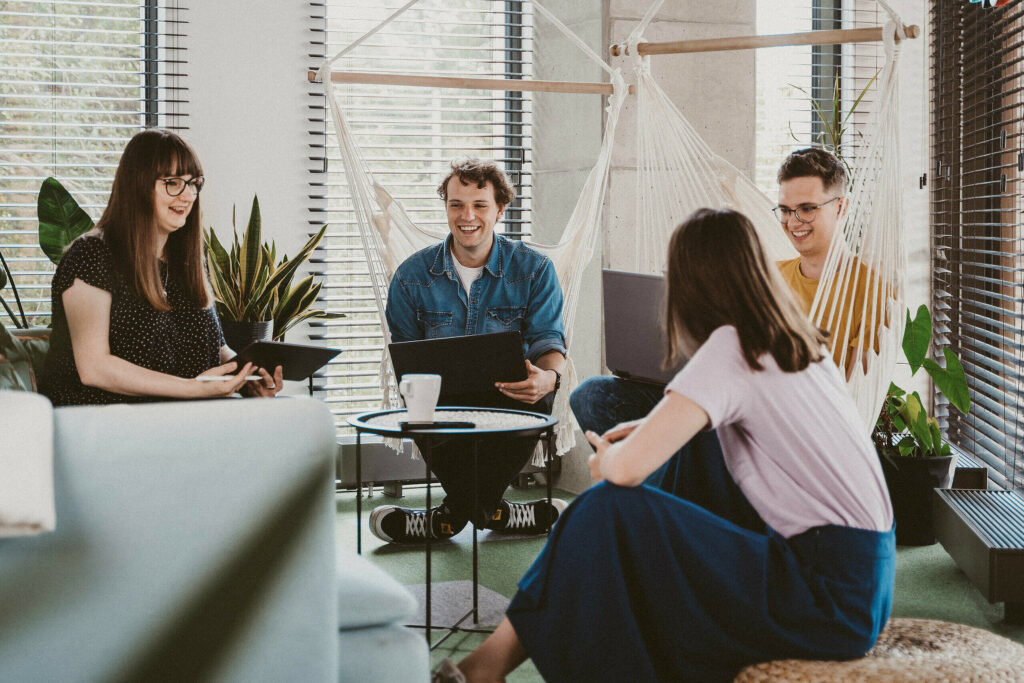 The picture presents the group of people working in the IT company